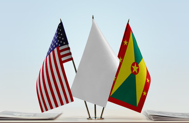 Flags of USA and Grenada with a white flag in the middle