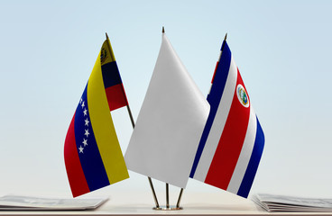 Flags of Venezuela and Costa Rica with a white flag in the middle
