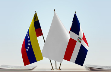 Flags of Venezuela and Dominican Republic with a white flag in the middle
