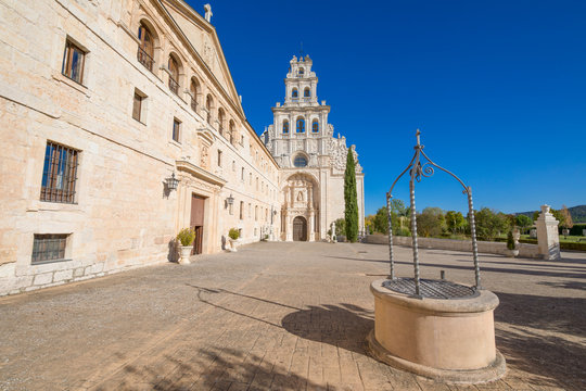 perspective of facade of Monastery Santa Maria de la Vid, church and water well, landmark and monument in Burgos, Castile and Leon, Spain, Europe
