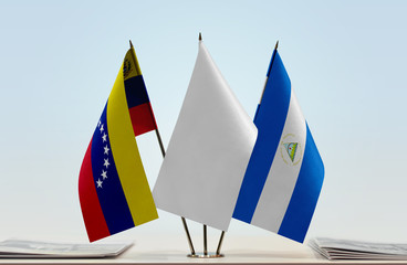 Flags of Venezuela and Nicaragua with a white flag in the middle