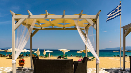 Sithonia peninsula of Greece Seascape With Beach Umbrellas And Sunbeds