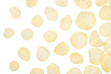 Yellow potato chips fly on white background, isolated, top view.