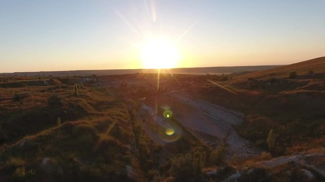 Sunrise moning cityscape clouds, building a sunset with sun, aero time dramatic sunset clouds, aerial Canyons flight, fly around active structures authentic view top authentic view western style