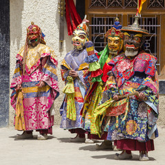 Buddhist lamas dressed in mystical mask dancing Tsam mystery dance in time of Yuru Kabgyat Buddhist festival at Lamayuru Gompa, Ladakh, North India