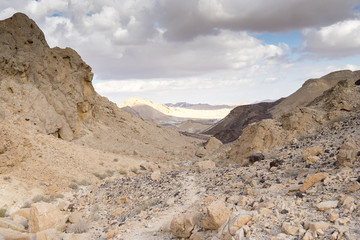Trekking in Negev dramatic stone desert, Israel