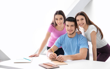 Young people posing together indoors. Unity concept
