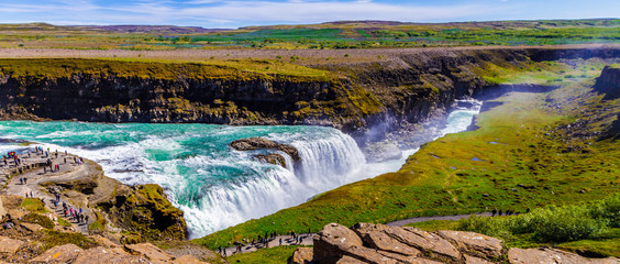 Grassy slopes and the Gullfoss waterfall in Iceland 11.06,2017