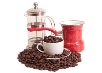 Coffee beans and a white cup on white background