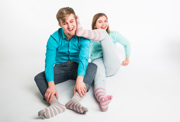 Portrait funny moments of excited couple fooling around to camera on white background. Having fun, weekends and valentines day concept