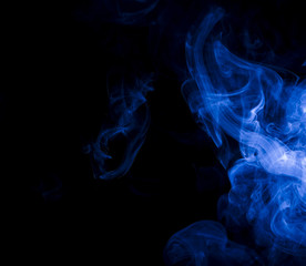 Blue smoke on black background