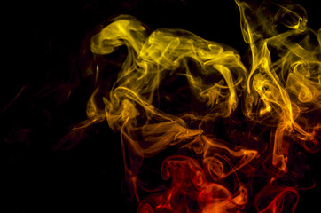 Colored smoke on black background