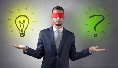 Businessman with idea versus question concept