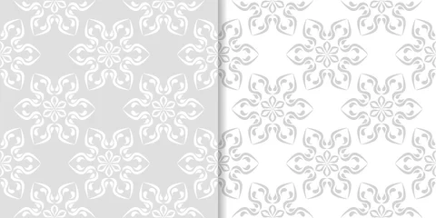 Gordijnen Light gray floral backgrounds. Set of seamless patterns © Liudmyla