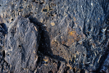 Natural black rock textured background.
