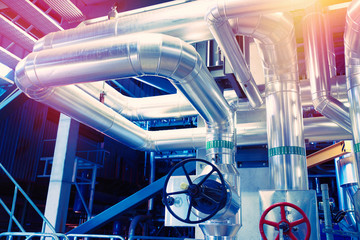 Fototapeta premium Equipment, cables and piping as found inside of a modern industrial power plant