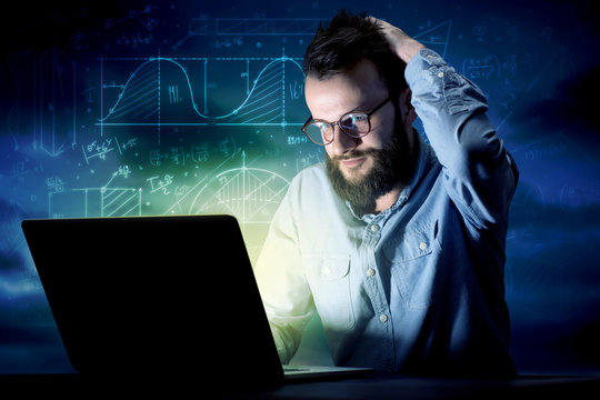 Businessman in the office at night