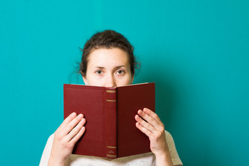 Reading the book, young beautiful girl reads book