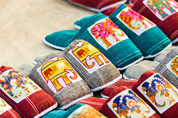 Souvenir slippers with an elephant on the market in, Luang Prabang, Laos. Close-up.