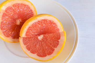 Close up of grapefruit fruit often include in weight loss programs .Healthy fruit background.