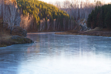 River Iset under ice, tourism in the Urals in Russia, Ural rocks