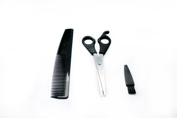 scissors for hair cutting, comb and brush isolated on white background