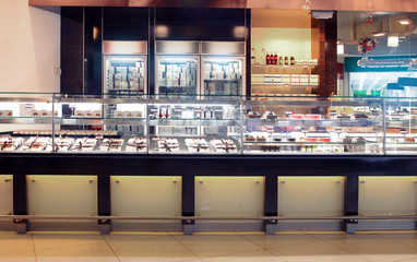 showcase in a confectionery store where pies, cakes, candies and cakes are sold