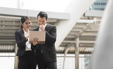 Businessman and businesswoman partner consulting and discussing at outdoor.