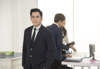 Portrait young asian businessman handsome looking for something.