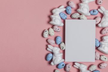 Easter holiday background with eggs, bunnies and a blank label sign