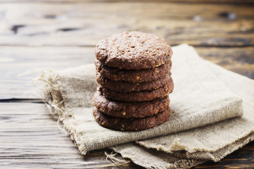 Sweet chocolate cookies on the wooden table