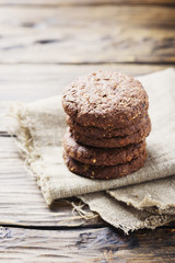 Sweet chocolate cookies on the wooden table
