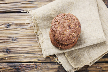 Sweet chocolate cookies on the wooden table
