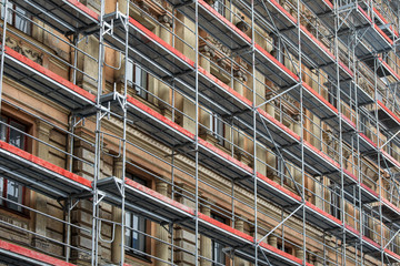 scaffolding around the house - historical building facade renovation - obrazy, fototapety, plakaty