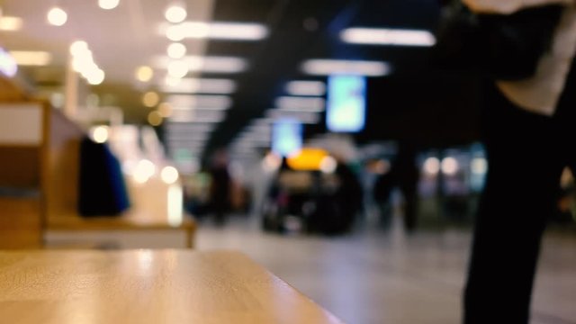 Defocused video of people walking to the departure counter in airport