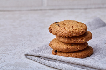 Stack of Chocolate chip cookies on wooden background. Stacked chocolate chip cookies shot with selective focus.