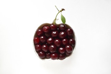 Beautiful and fresh cherry in a bowl on a white background