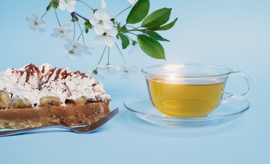 cake with tea on blue background