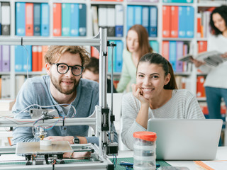 Students using a 3D printer