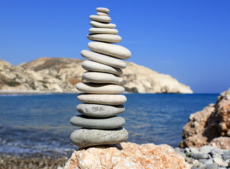 balanced stones on sea
