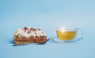 cake with tea on blue background