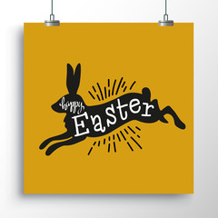 Silhouette of a black rabbit with a handwritting happy Easter on the gold poster