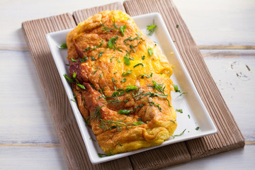 Omelette with grated cheese. Eggs for breakfast or brunch. horizontal