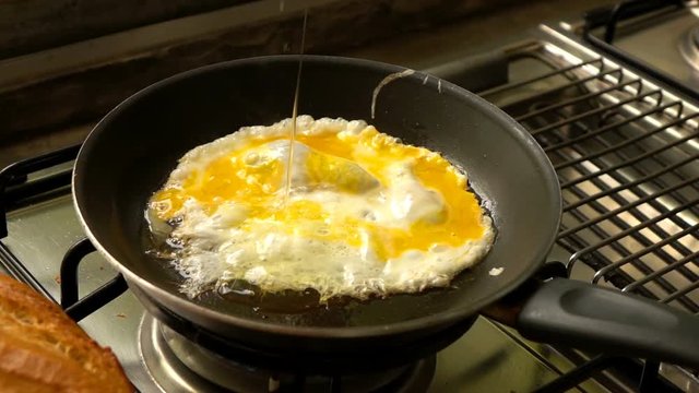 Cooking, egg falling on pan, super slow motion 240fps
