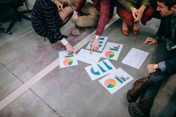 Gathered around the colorful business data