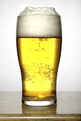 Glass of beer on white