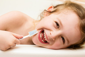 Happy little girl lost her primary tooth