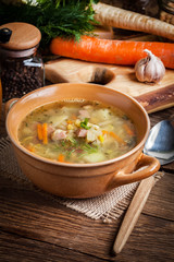 Pea soup with vegetables and bacon.