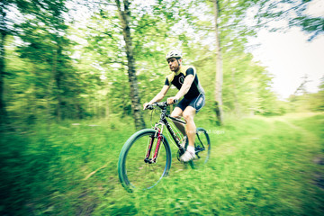 Fototapeta na wymiar Young Man Riding His Mountain Bike