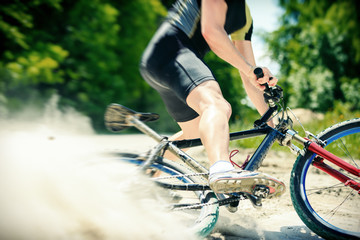 Naklejka premium Young Man Riding His Mountain Bike